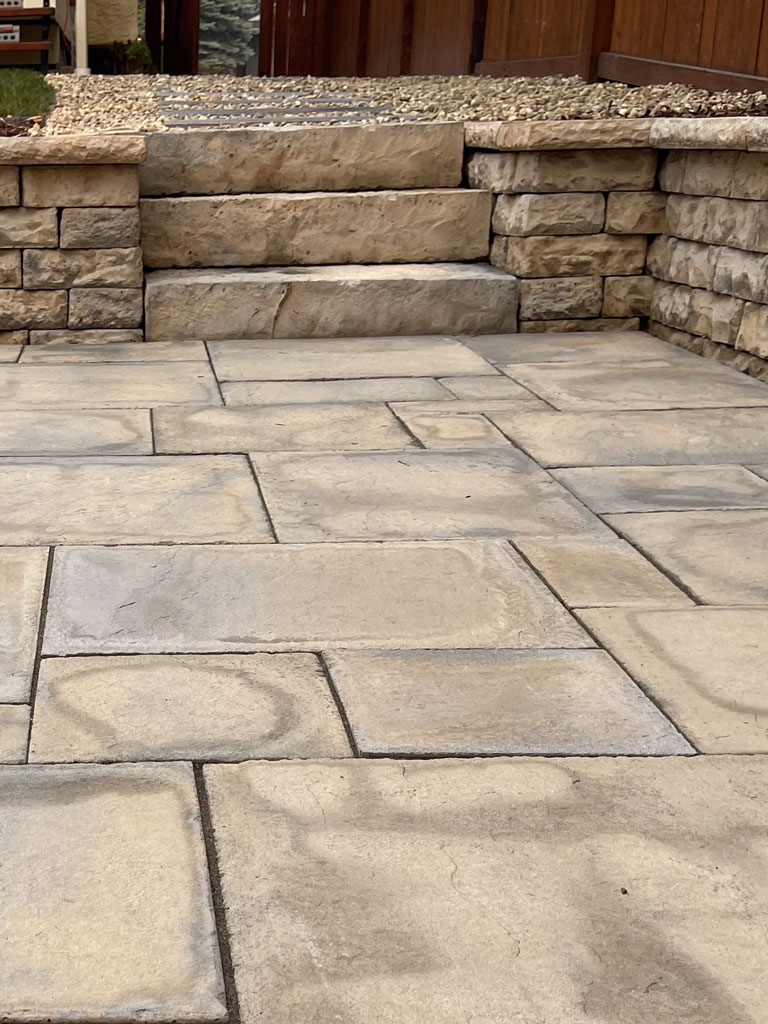 Large stone retaining wall and patio mobile